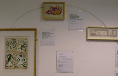 detail of a wall of images and poetry
