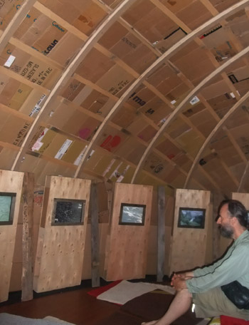 The roof and curved wall is covered in cardboard