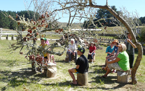 Land Art or a Site specific outdoor sculpture made out of firewood and dead trees by Sen McGlinn + Sonja van Kerkhoff at the 2013 Tahora High-country International Sculpture. Marco primary school about 30km west of here came to visit as an after school activity.